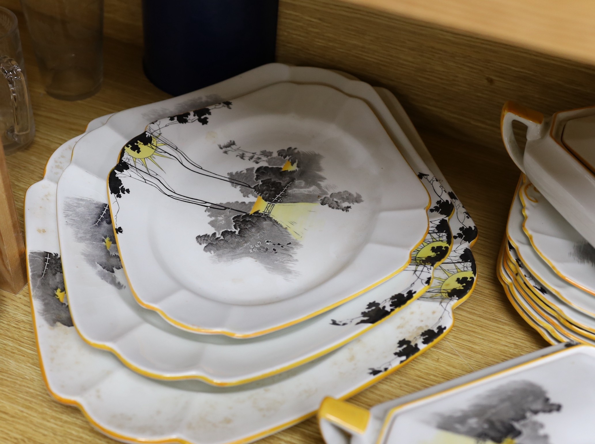 A 1930s Shelley Queen Anne shape Art Deco Sunshine and Tall Trees pattern tea and dinner wares, approx 43 pieces